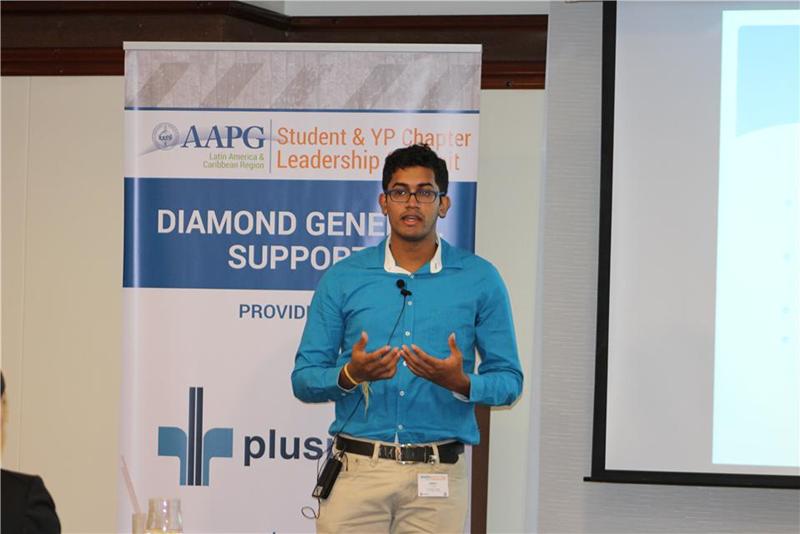 Amrit delivers the UWI-STA chapter report to Summit participants.